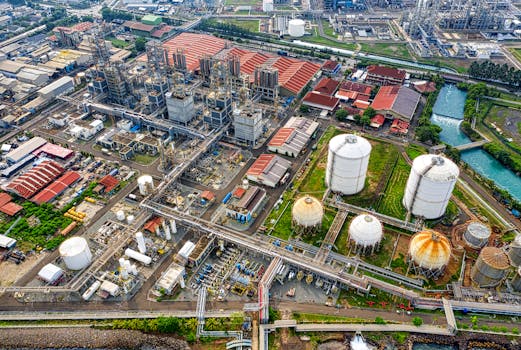 A detailed aerial view of an industrial facility in Banten, Indonesia, showcasing large tanks and architectural structures.