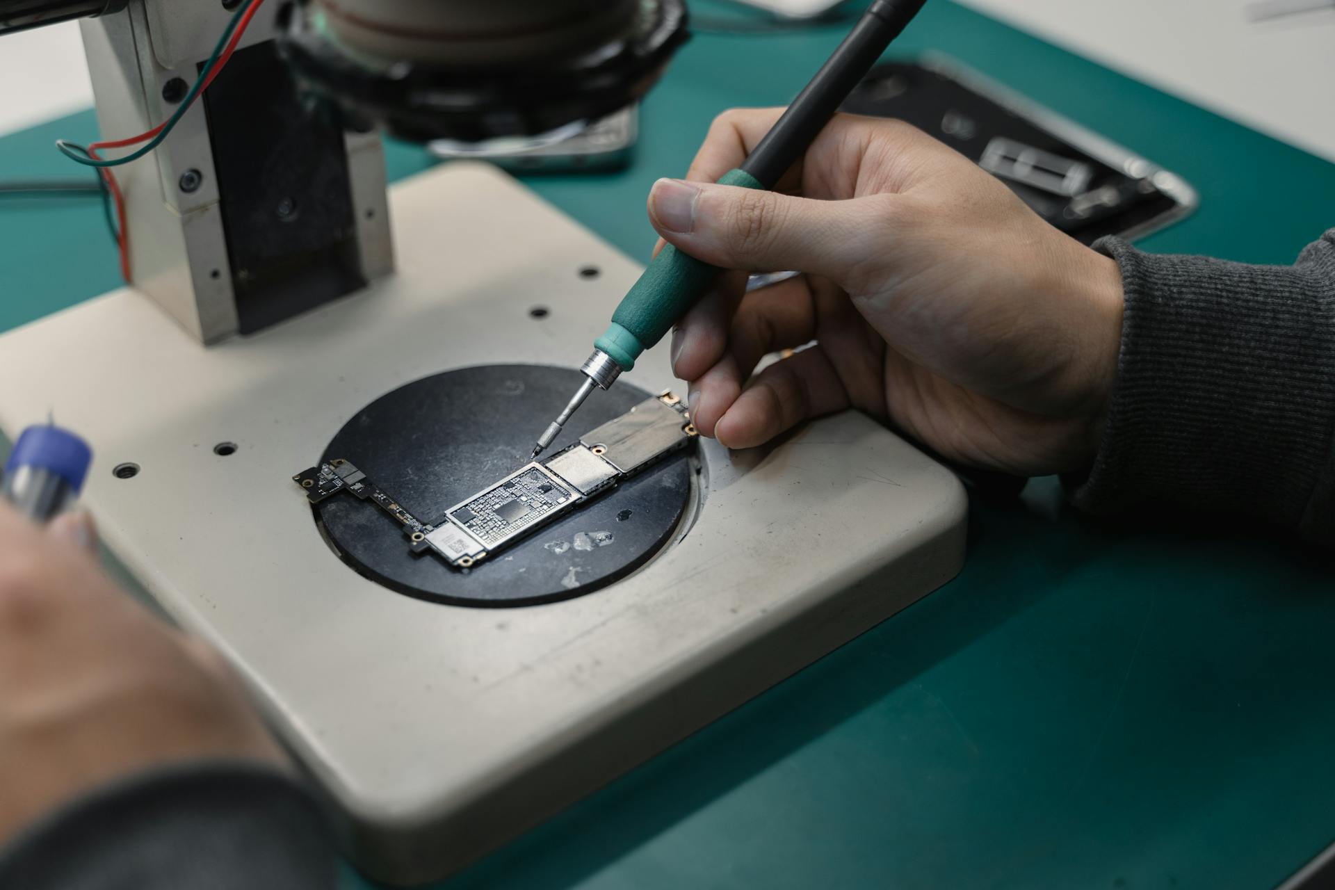 A Person Holding a Soldering Gun