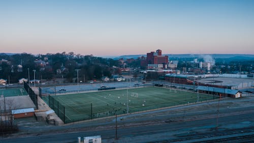 Free Sports ground in city suburb under sundown sky Stock Photo