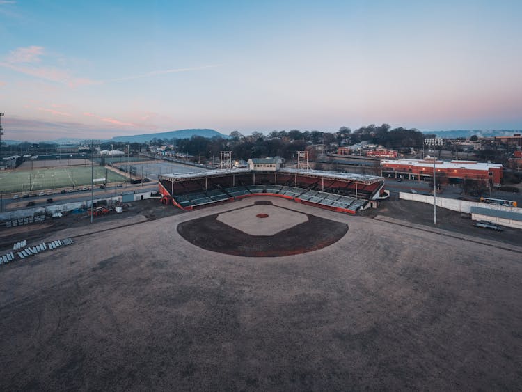 Empty Baseball Field Under Sundown Sky