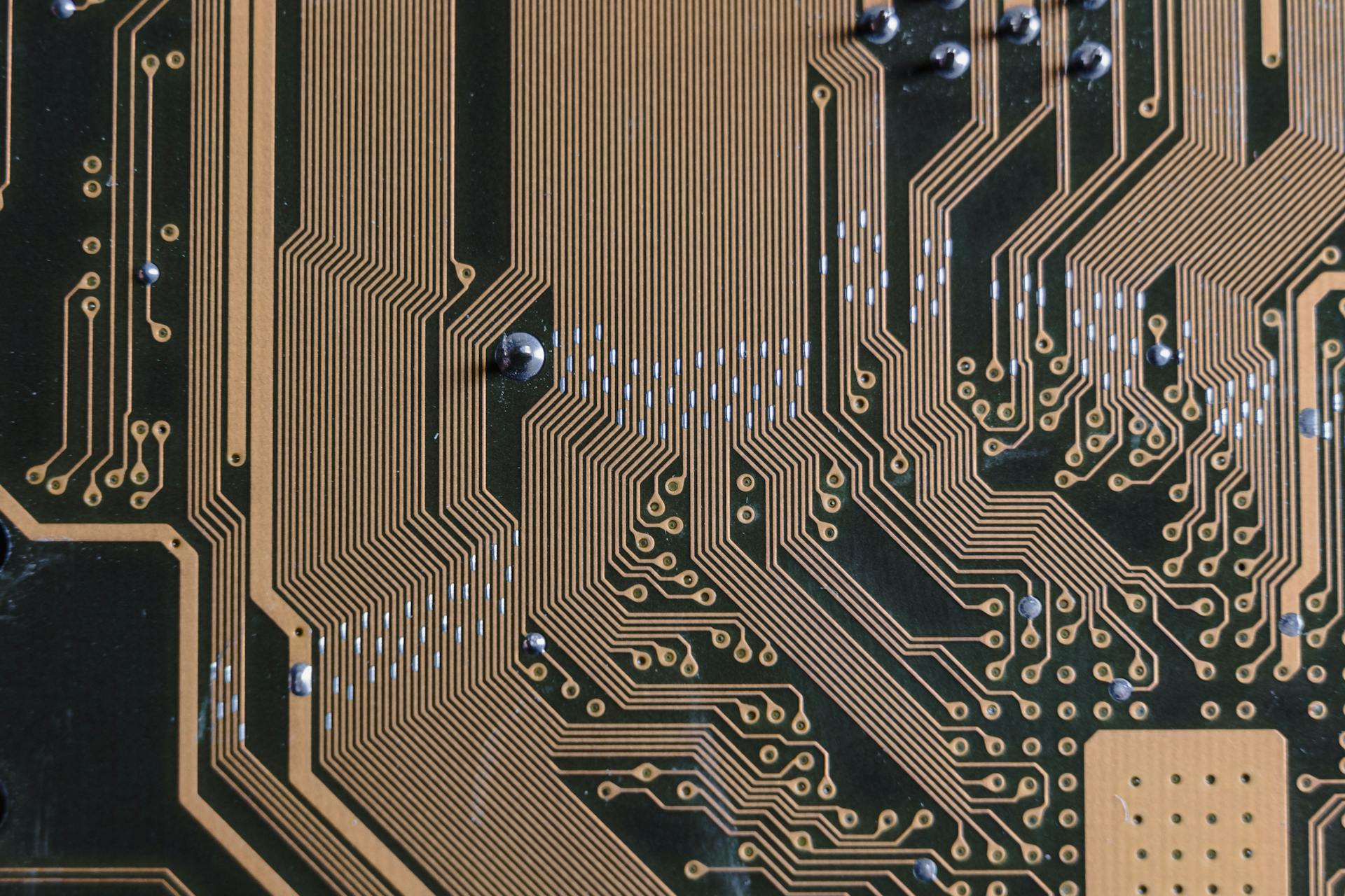 Gold Circuit Board in Close-up Photography