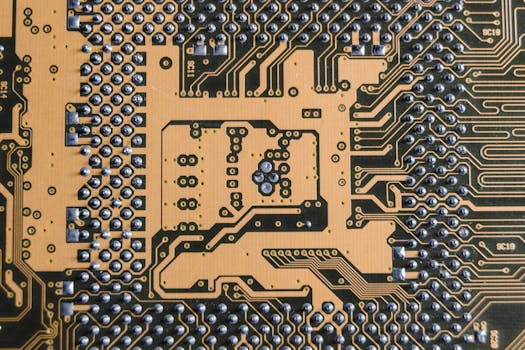 Detailed view of a circuit board showcasing intricate patterns and metallic connections.