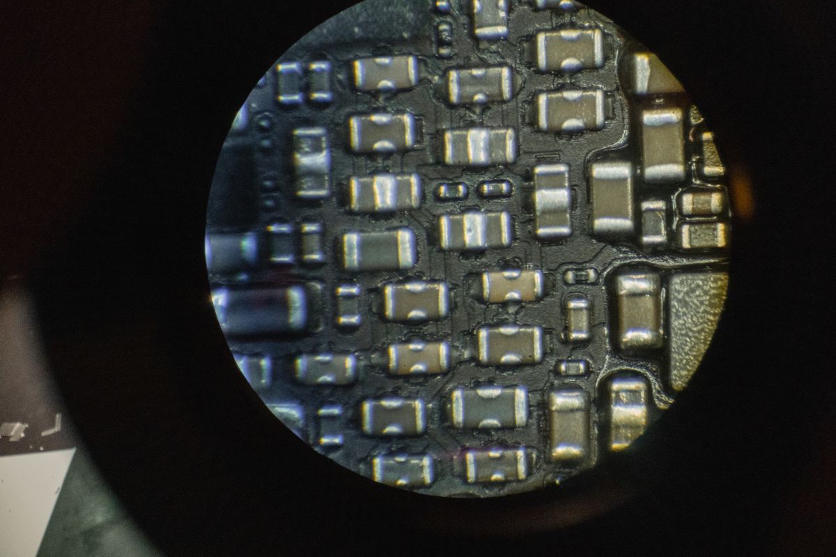 Microchip components viewed through a laboratory microscope at high magnification