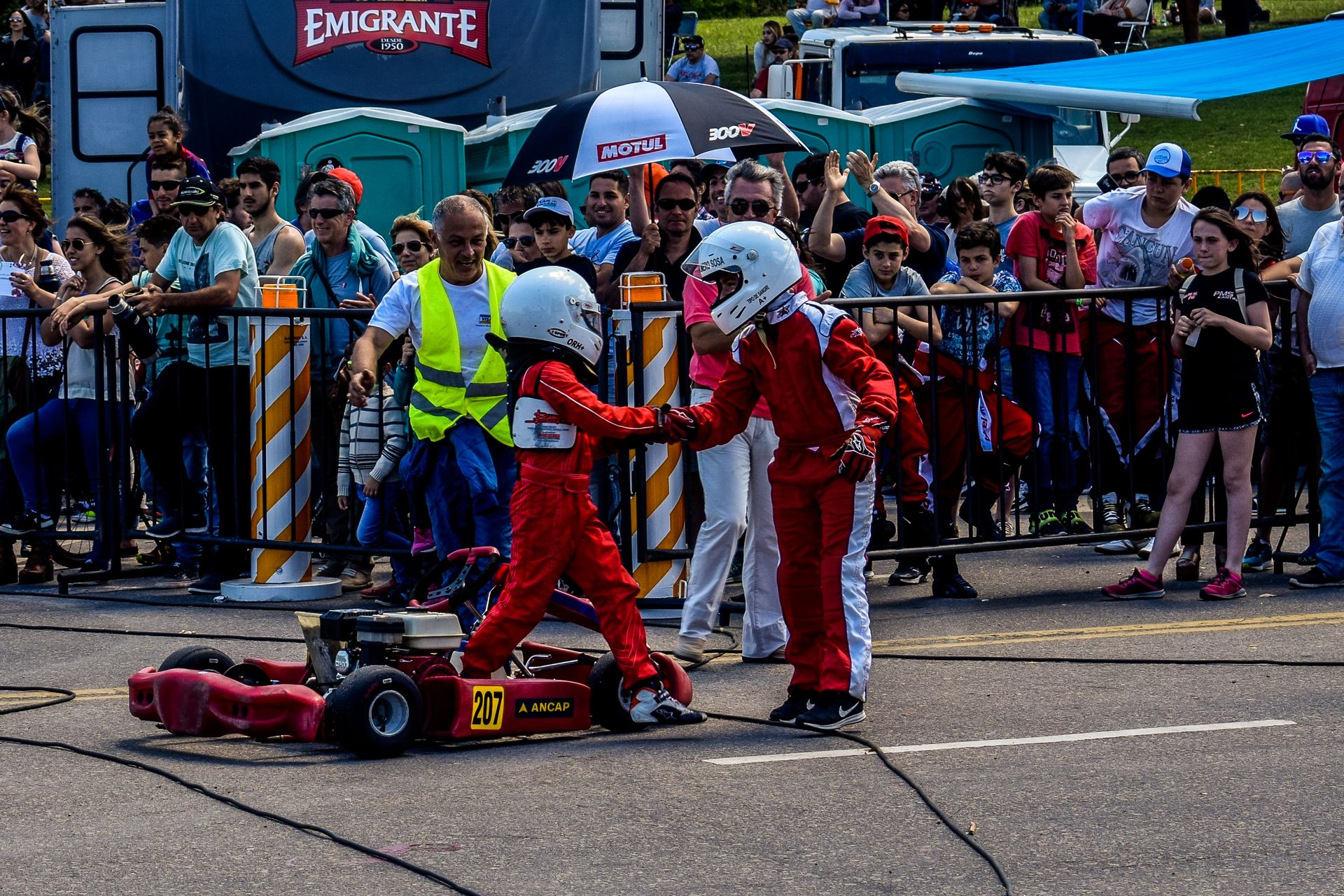 Two Boy in Red and White Racing Costume