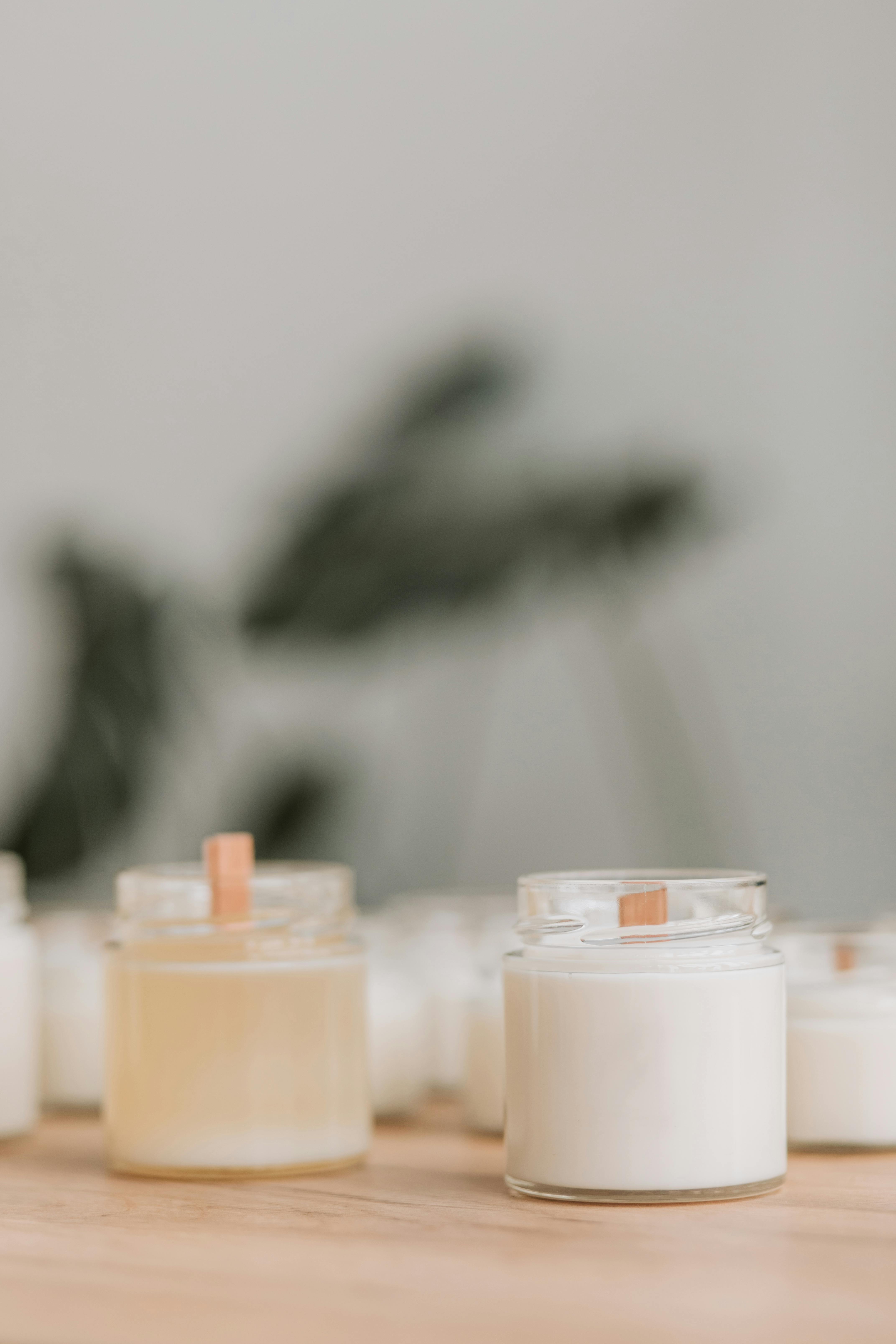 Lighted Candles in Glass Containers · Free Stock Photo