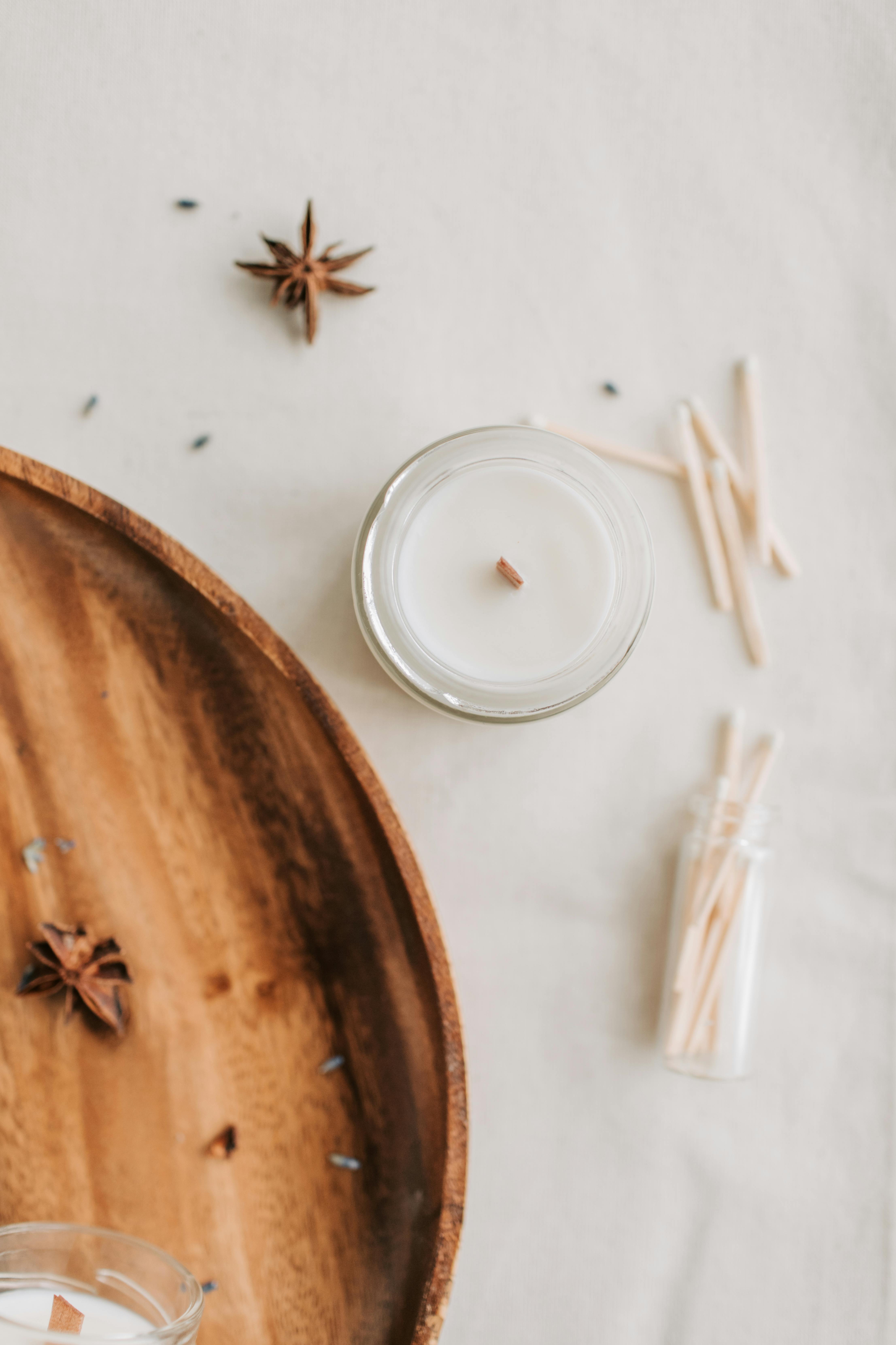 overhead shot of a candle near a star anise