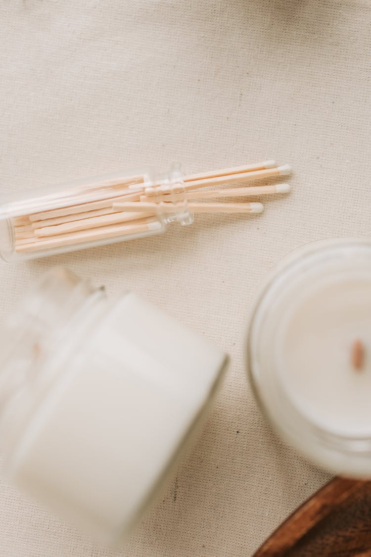 Close-Up Photograph Of Candles Near Match Sticks