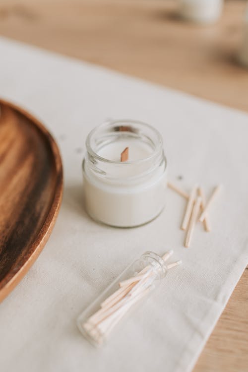 Close-Up Photo of Candle on Glass