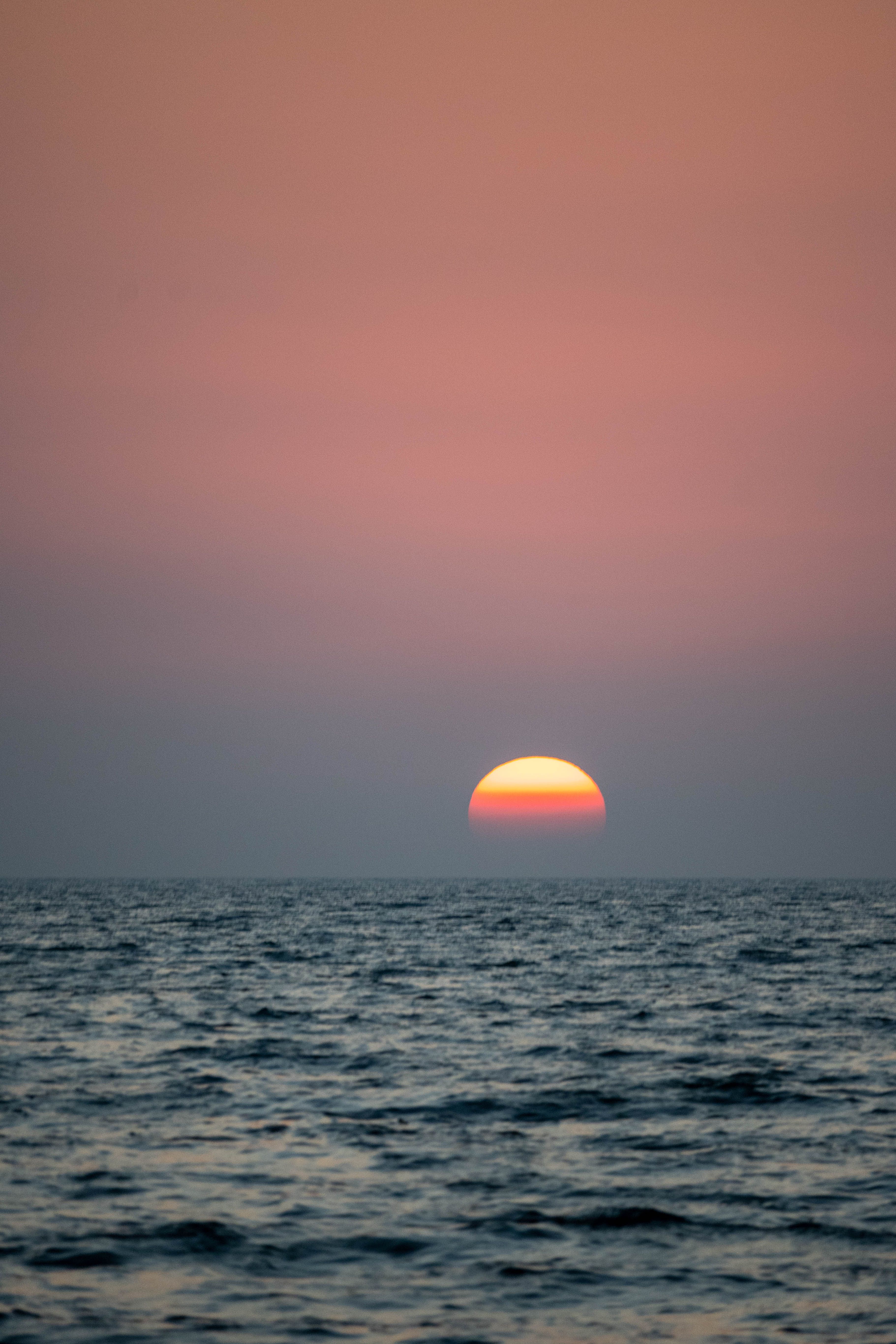 Yellow Sky over Sea at Sunset · Free Stock Photo