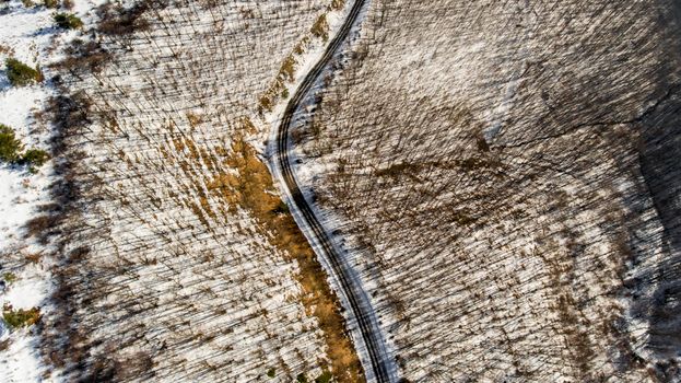 Aerial view of snow-covered landscape with road in Sliven, Bulgaria.