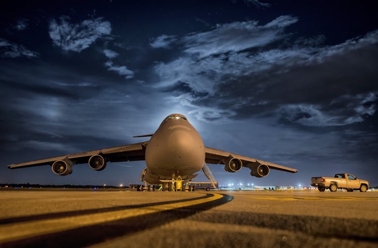 Airplane In Front And Night Sky