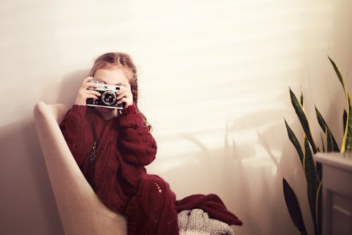 A Girl using Old Camera 