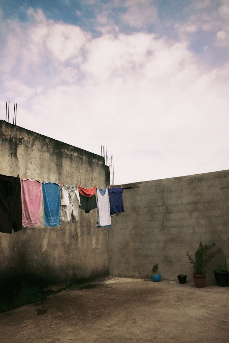 Drying Clothes By Wall