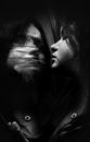 Woman with eyes closed reflecting in wet mirror