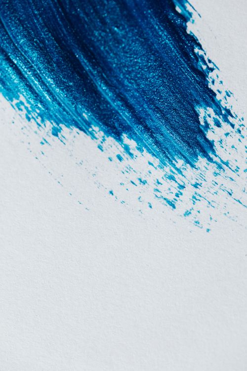 Free A close-up of an abstract blue brush stroke on a white canvas, showcasing texture and artistic design. Stock Photo