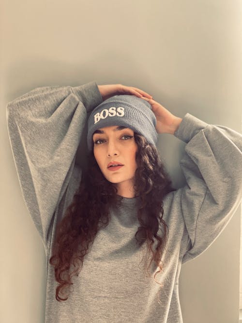 Woman Wearing Gray Sweater and Beanie