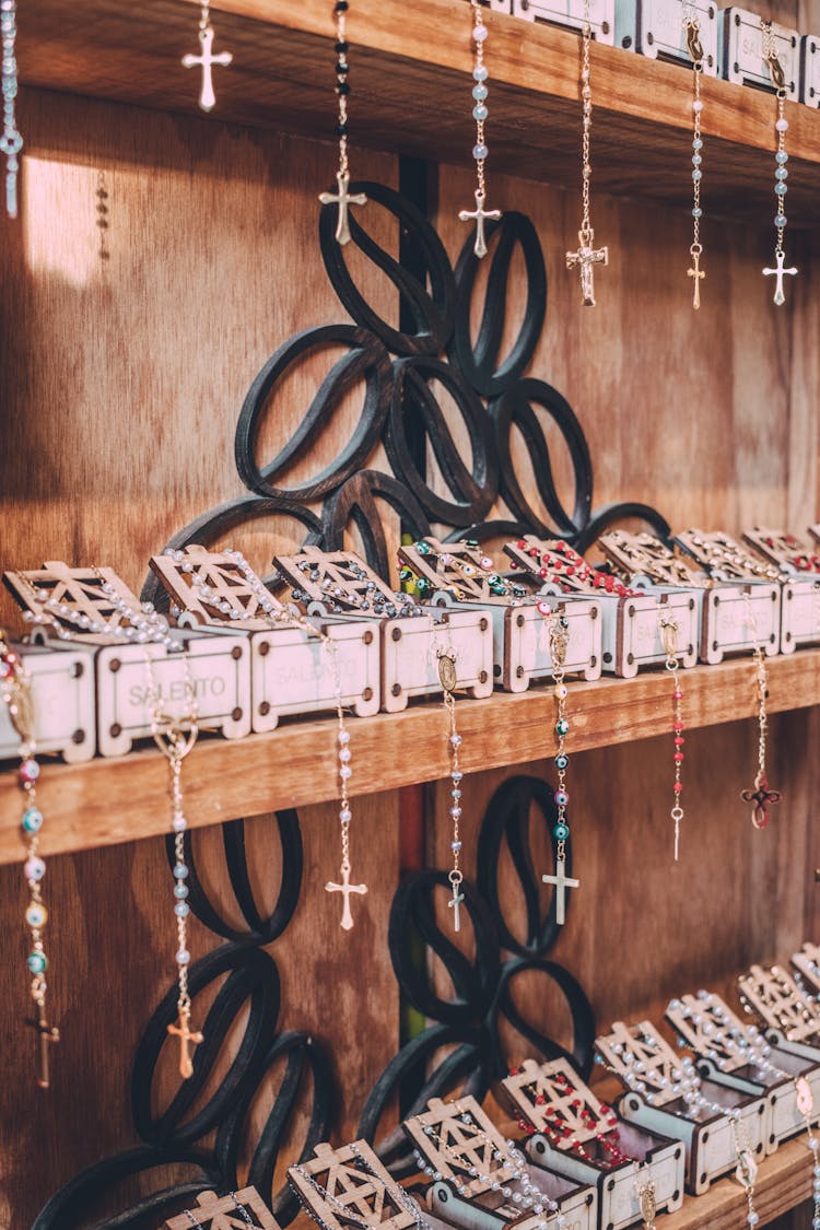 Rosaries Displayed On Shelves