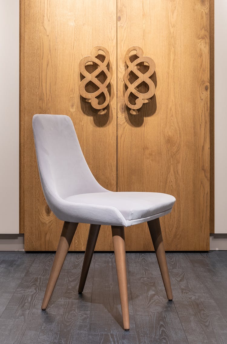 Stylish Chair Near Wooden Cupboard