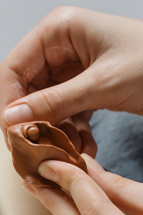 Free A Person Holding Brown Clay Stock Photo