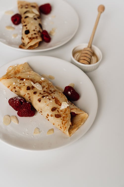 Free Two Plates of Crepes with Fruits Stock Photo