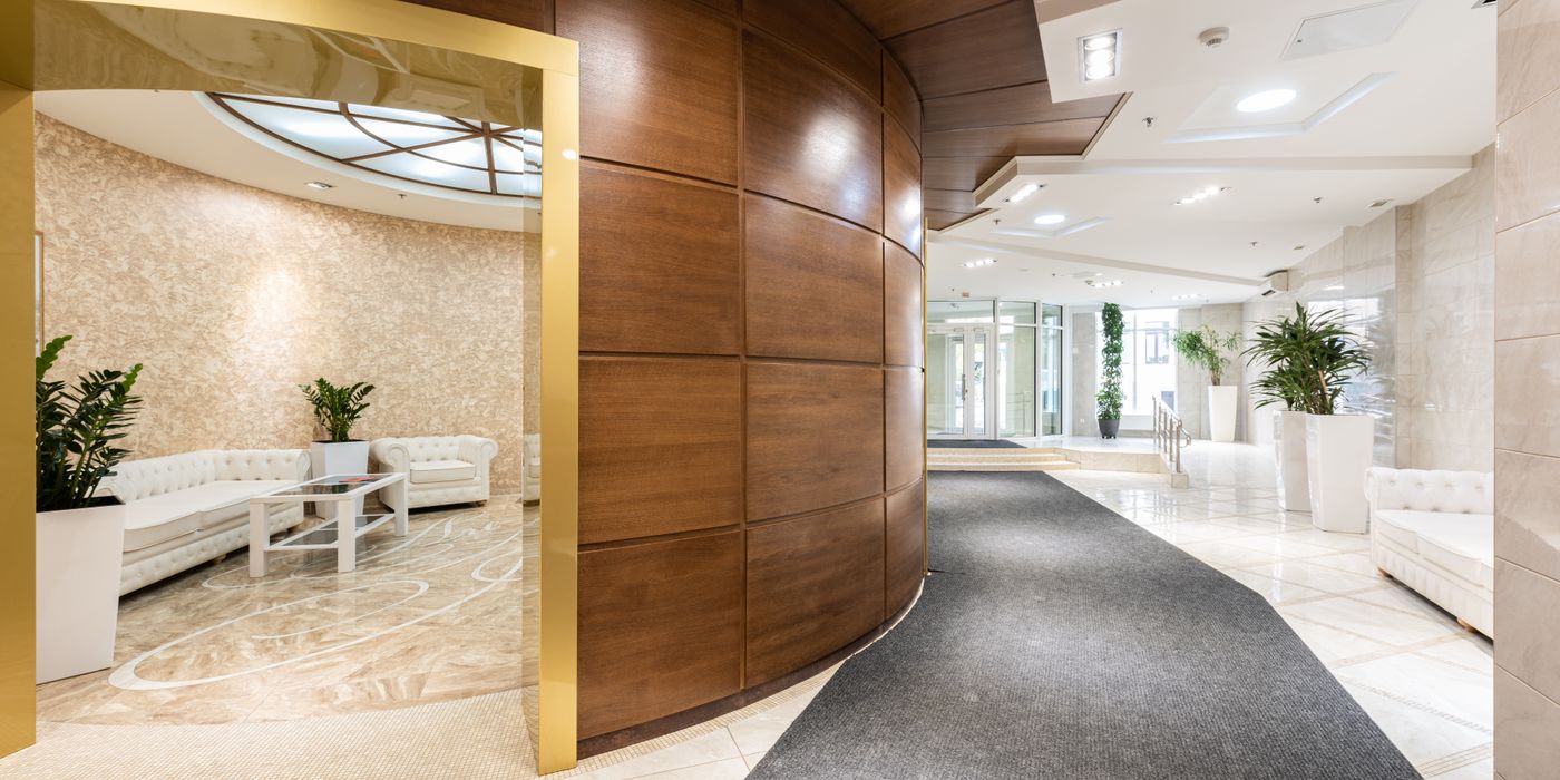 Modern hotel lobby with high ceilings and natural light