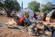 Children sitting in refugee camp