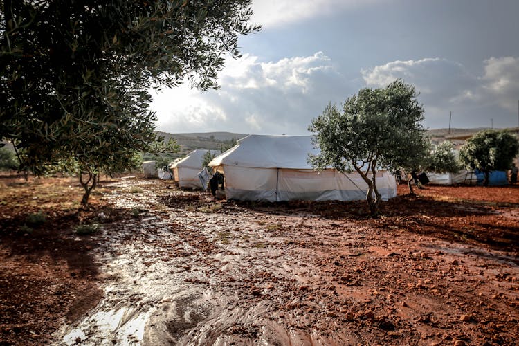 White Tents On Dirty Ground