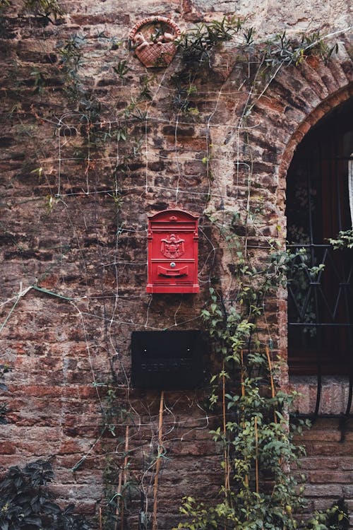Red Vintage Mailbox on an Old Wall