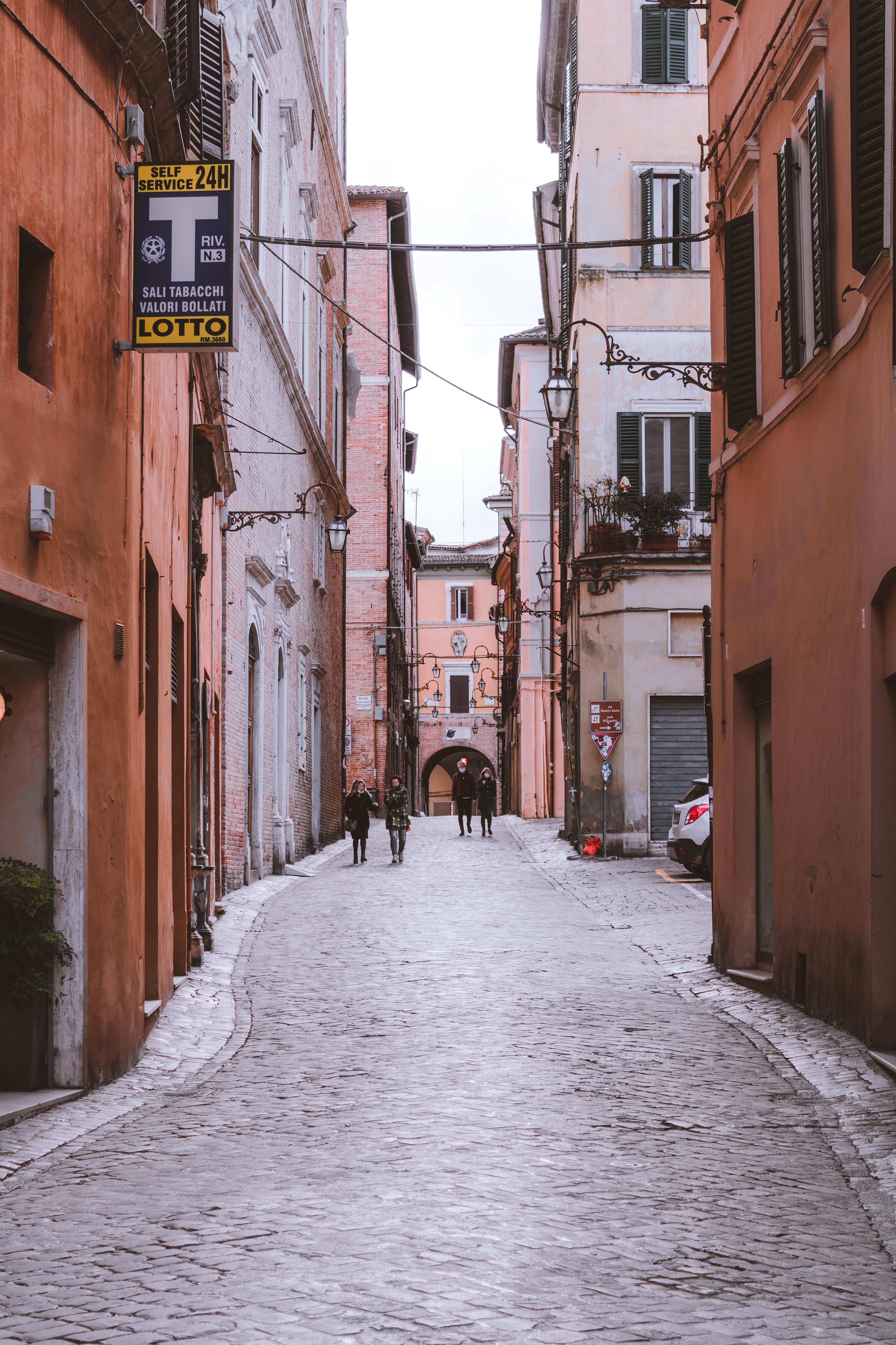 Alley with Railing Beside Houses · Free Stock Photo