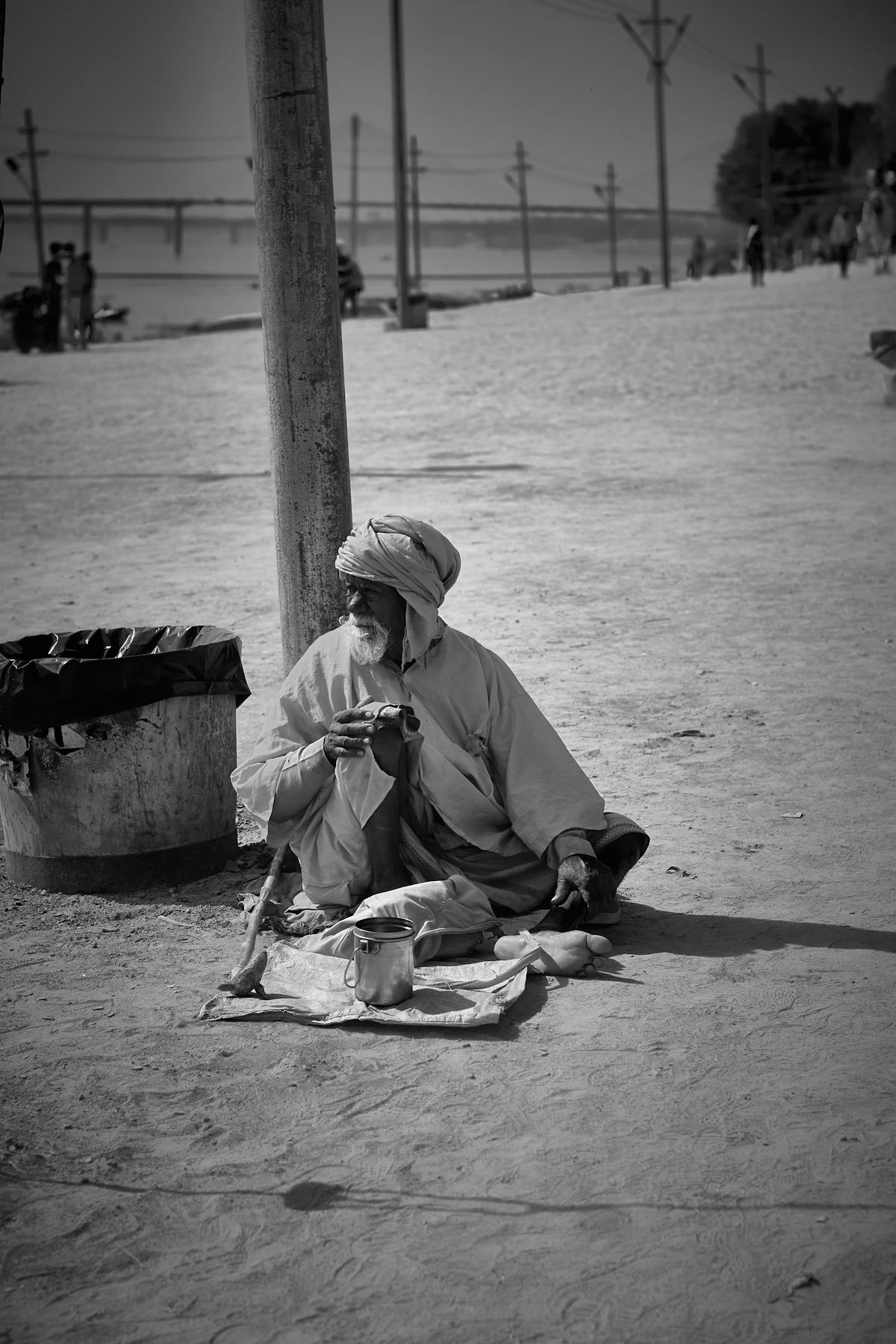 Warm minimalist living room with beige walls, light wood coffee table, neutral sofa, and layered lighting