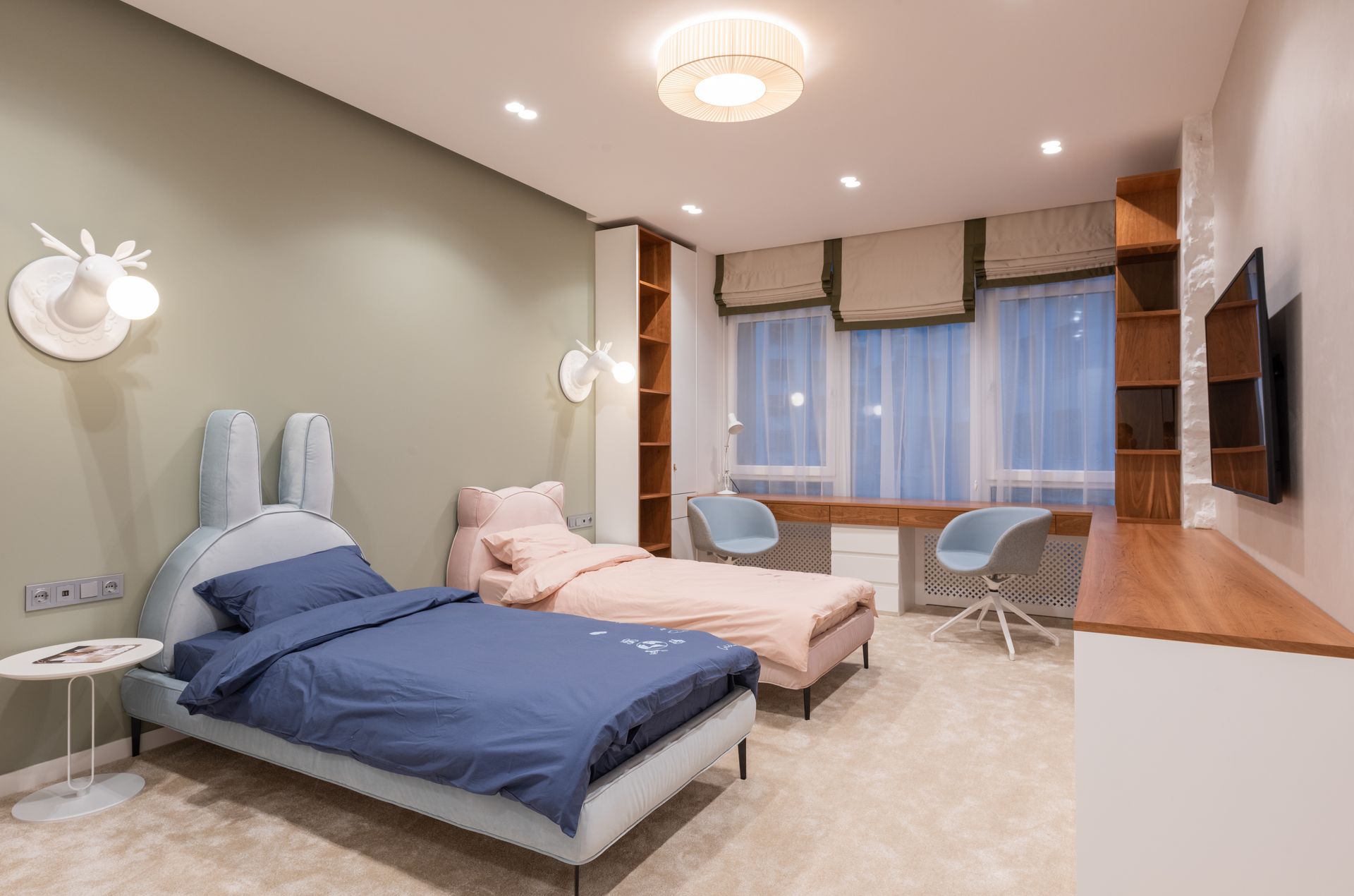 Elegant bedroom with modern decor, twin beds, and stylish furnishings.