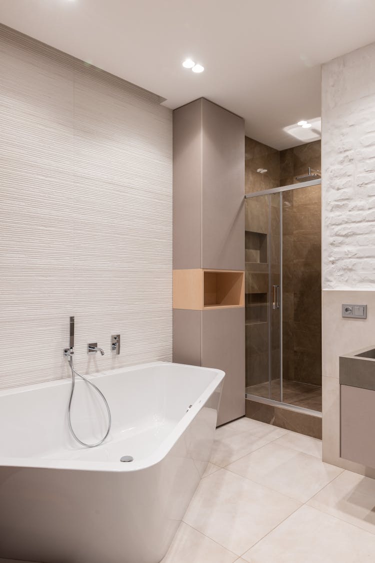 Bathroom Interior With Bathtub Next To Shower