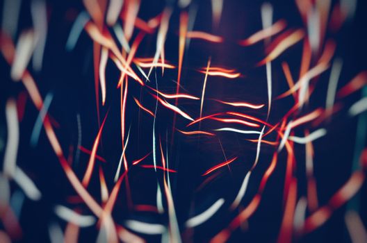 Abstract photo featuring vibrant light trails and artistic patterns in motion.