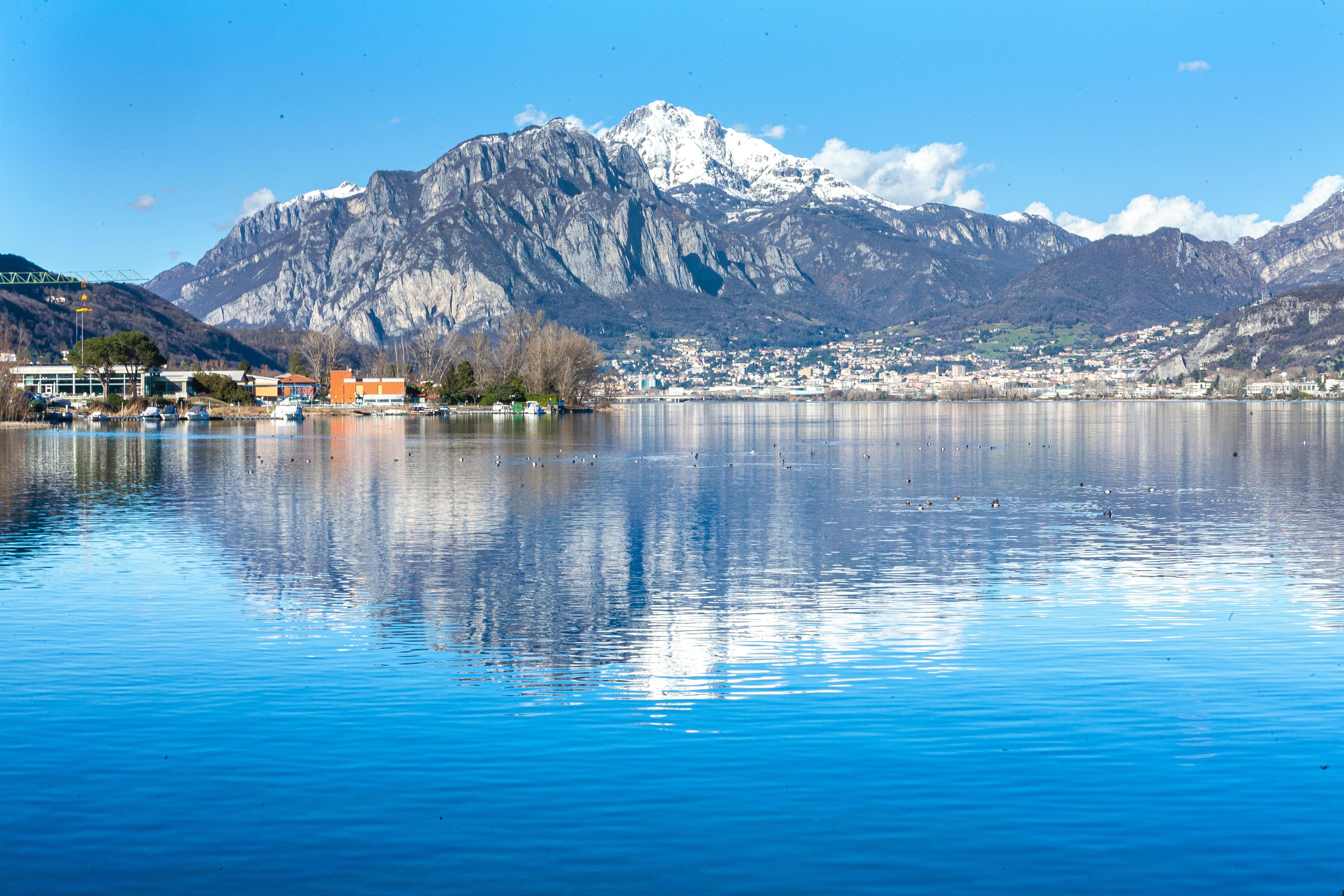 blue body of water with mountain view