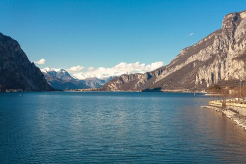 Free Scenic view of mountains and lake in Lecco, Italy, offering serenity and beauty. Stock Photo