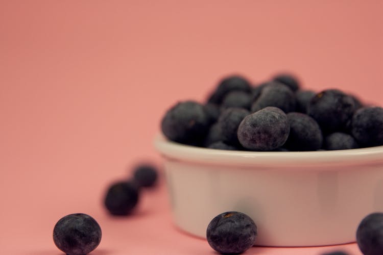 Black Berries On White Ceramic Bowl