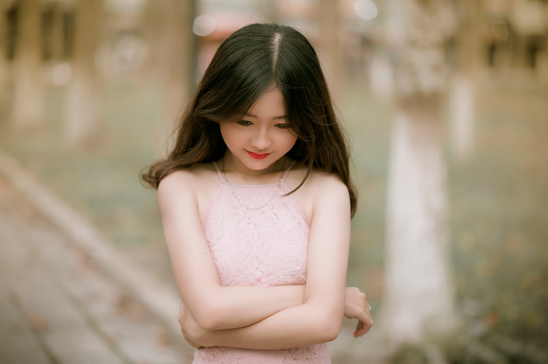 Free Shallow Focus Photography of Woman in Pink Dress Stock Photo