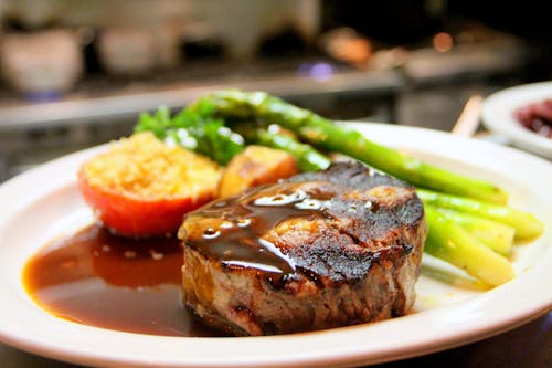 Free Selective Focus Photography of Beef Steak With Sauce Stock Photo