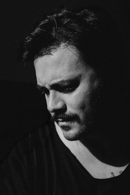 Free Black and white of adult male with beard and mustache contemplating on black background Stock Photo