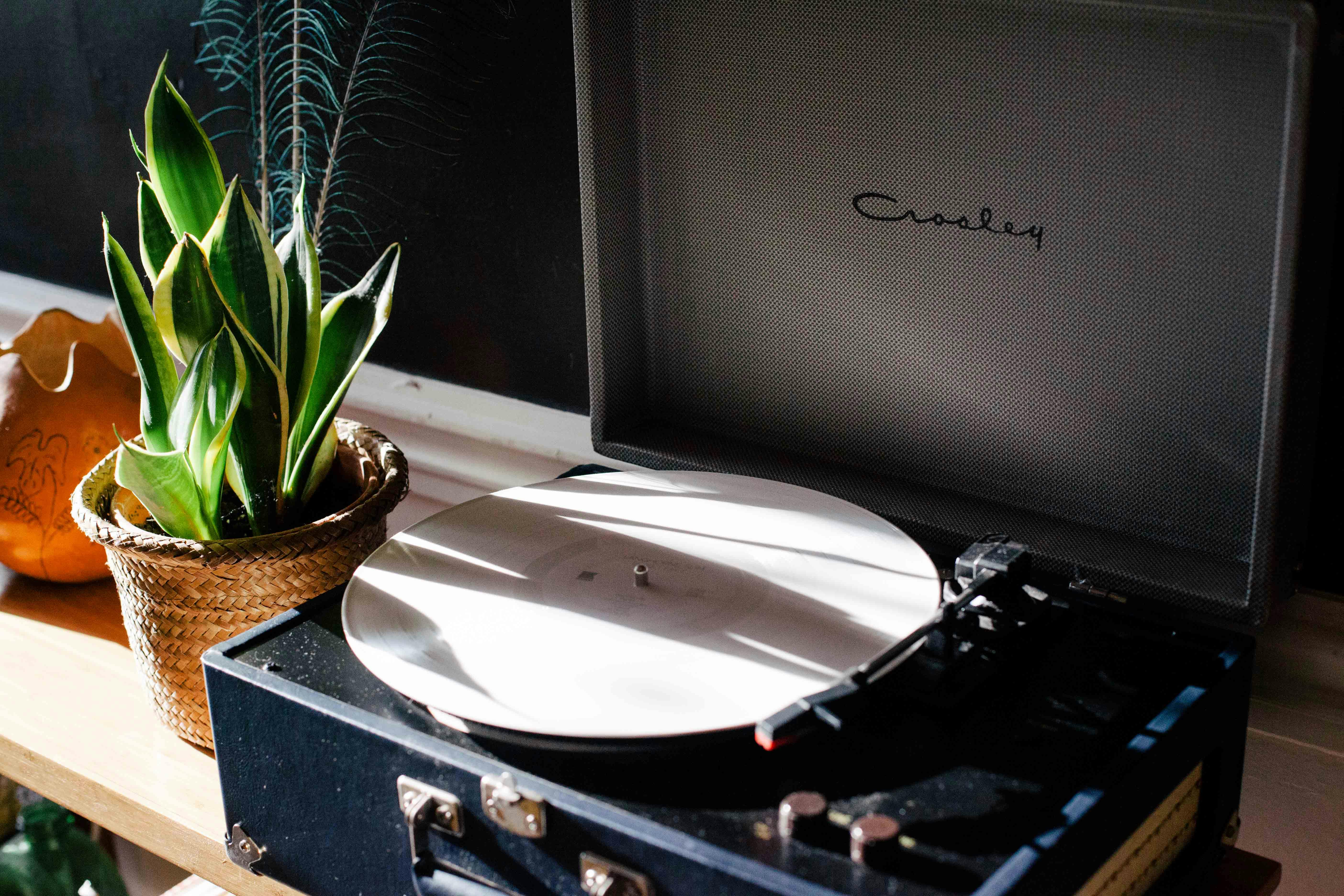 Black and White Crosley Vinyl Record Player on White Wooden Frame · Free Stock Photo