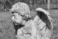 Stained Cherub Statue