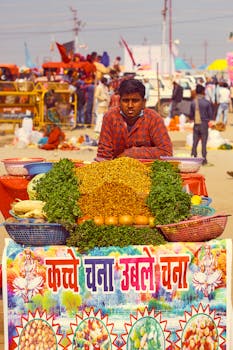 Local vendor selling fresh vegetables at an outdoor market, vibrant and lively setting.