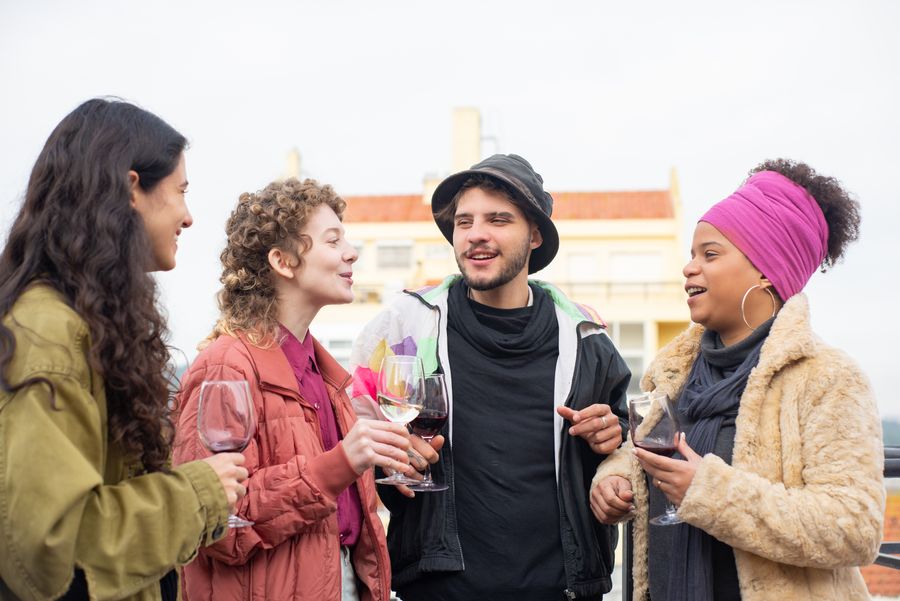 A group of friends talking outdoors, photo by Kampus Production on Pexels