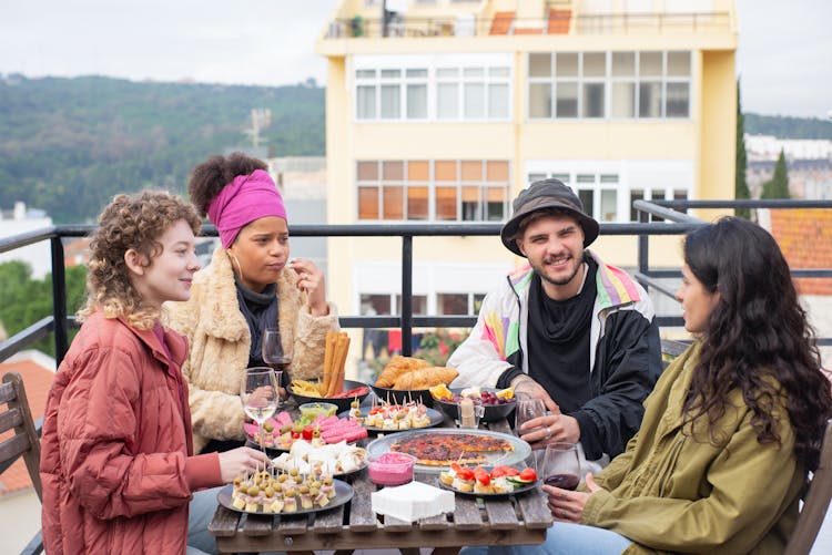 Friends At Dinner On Terrace