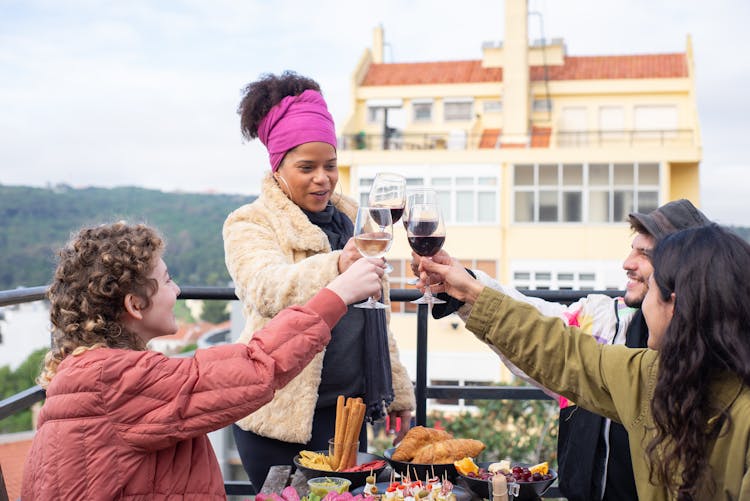 Happy People Toasting Wine Glasses