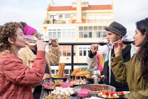 Friends Drinking at the Rooftop 