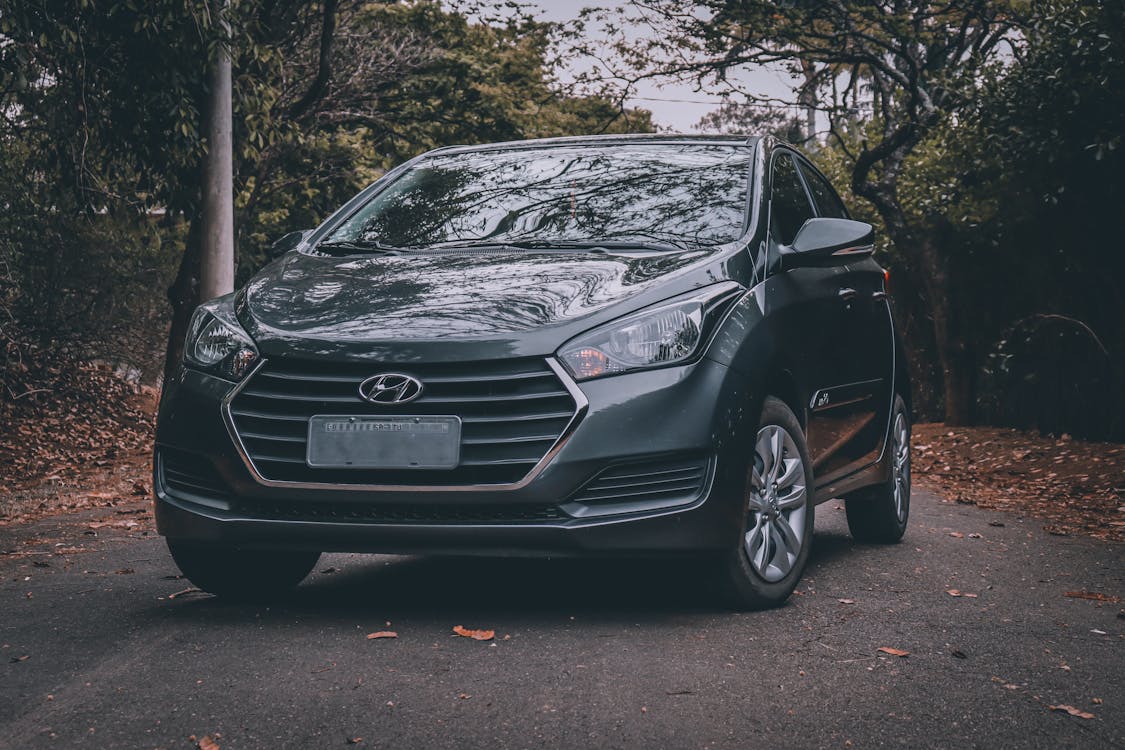 Free Black Hyundai Car Parked on the Road Between Trees Stock Photo