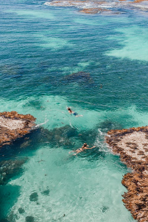 Drone Shot of People Swimming on a Lagoon