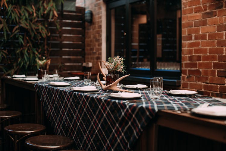 Plaid Tablecloth On Wooden Table