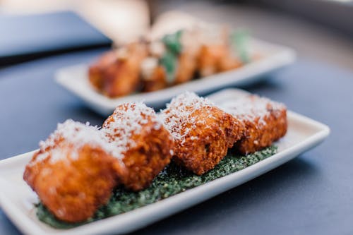 Fried Food with Pesto and Cheese Garnish